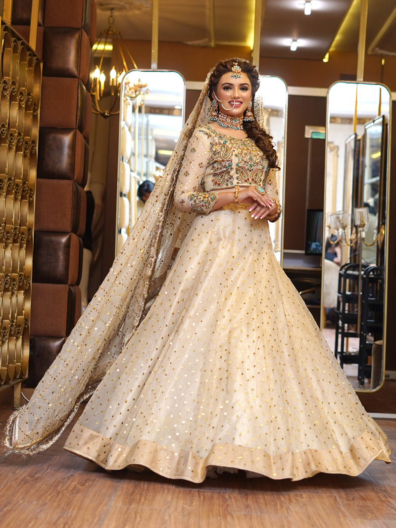 beige colored lehenga choli embellished bridal dress