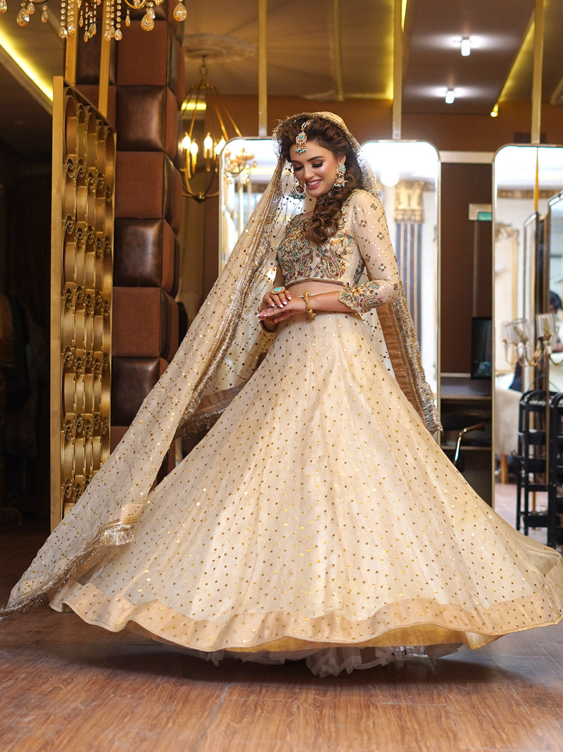 beige colored lehenga choli embellished bridal dress