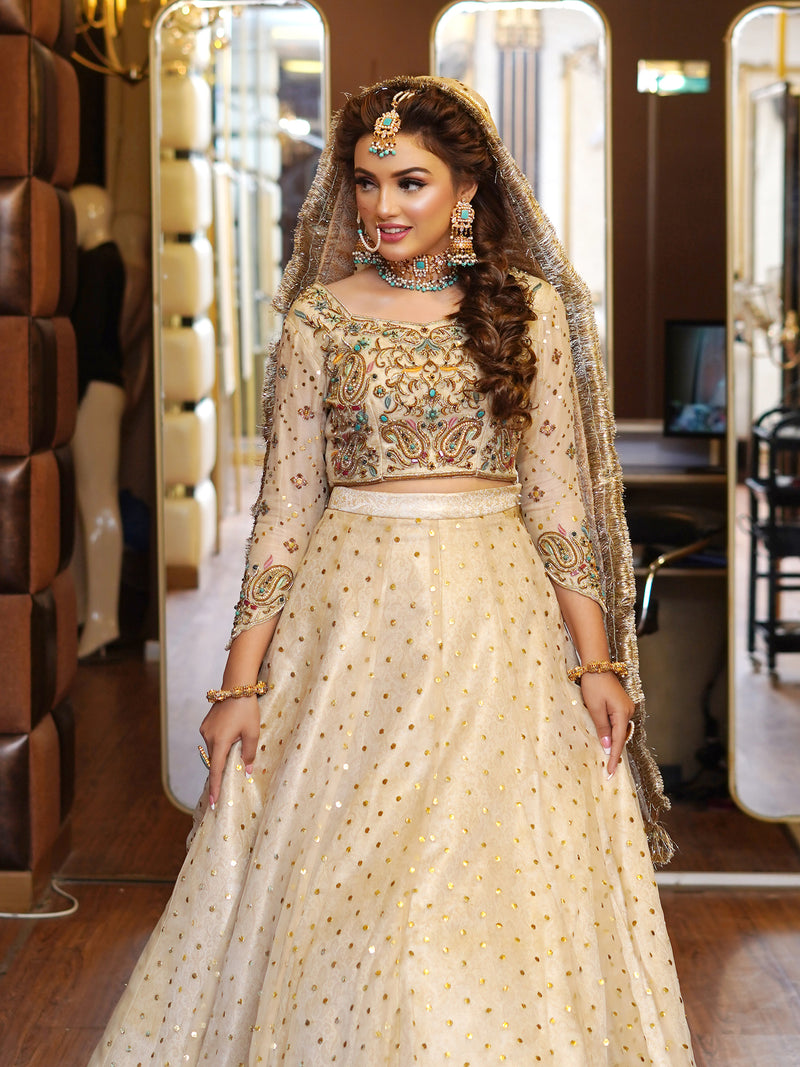 beige colored lehenga choli embellished bridal dress