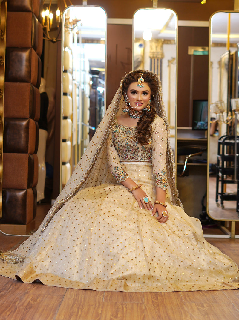 beige colored lehenga choli embellished bridal dress