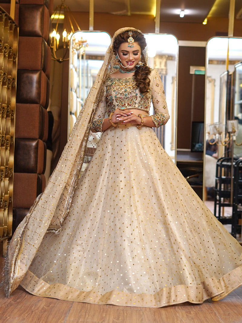 beige colored lehenga choli embellished bridal dress